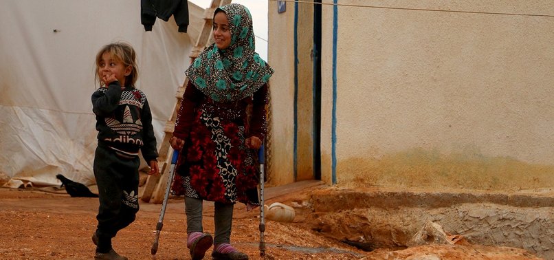 SYRIAN GIRL WALKS TO SCHOOL AFTER RECEIVING PROSTHETIC LEGS IN TURKEY