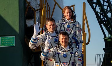 Two Russians, American reach space station