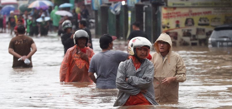 9 DEAD, THOUSANDS CAUGHT IN FLOODING IN INDONESIAS CAPITAL