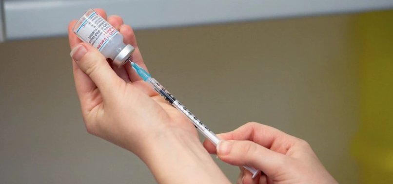 VARIANT-ADAPTED COVID VACCINE WINS FIRST APPROVAL IN BRITAIN