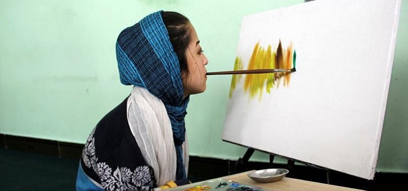 DISABLED AFGHANI GIRL MAKES LIVING BY SELLING PAINTINGS