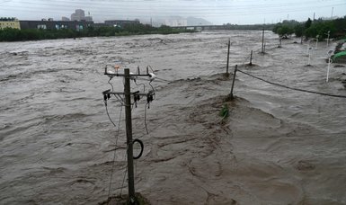 Flashfloods kill 7 in southwestern China, death toll climbs to 33 in Beijing downpour