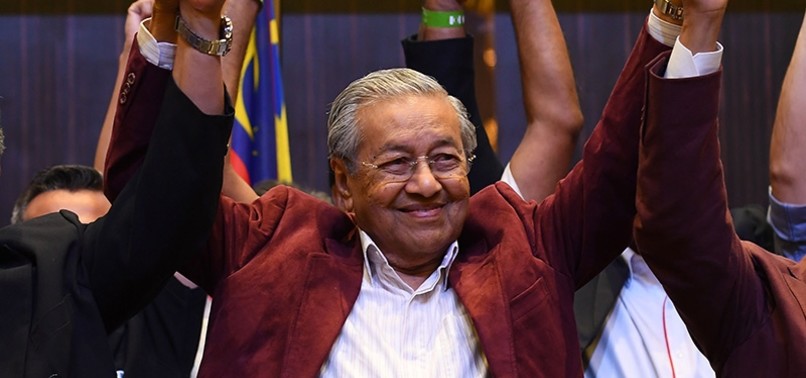 IN HISTORIC VICTORY, MALAYSIAS OPPOSITION WINS MAJORITY IN PARLIAMENT