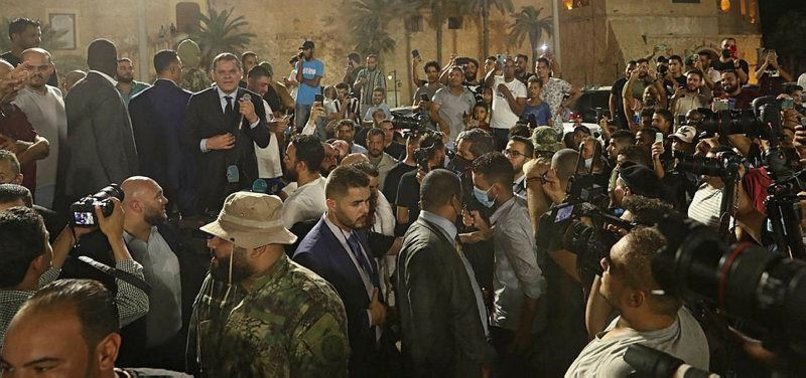 LIBYA PM DRAWS CROWD FOR MASS WEDDING AND PROTEST AGAINST PARLIAMENT