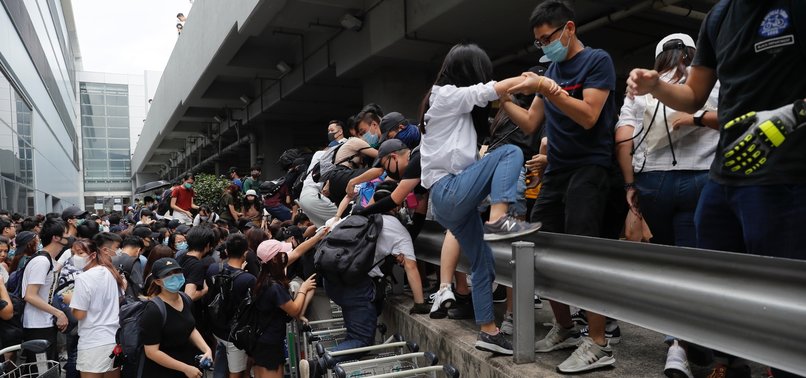 HONG KONG AIRPORT TRAIN SHUT DOWN AS PROTESTERS PLAN TO DISRUPT TRAVEL