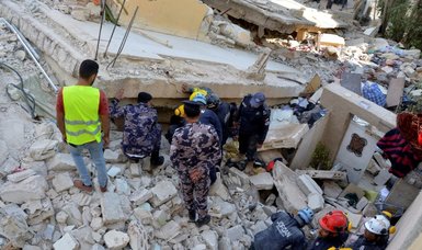 At least 10 people trapped in collapsed building in Jordan