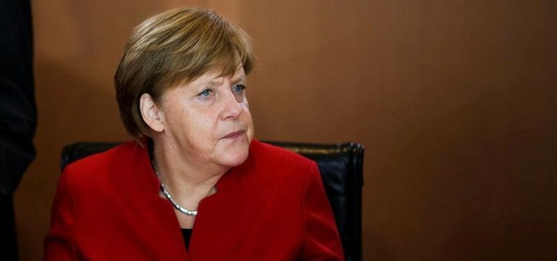 MERKEL RECEIVES ELECTION BOOST WITH PROJECTED WIN IN NORTHERN STATE