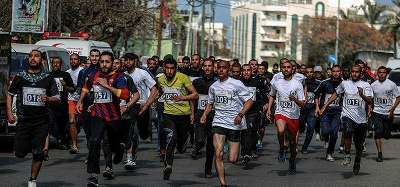GAZANS RUN IN SUPPORT OF JAILED PALESTINIANS IN ISRAEL