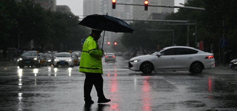 TWO DEAD IN BEIJING AS RAIN BATTERS CHINESE CAPITAL: STATE MEDIA
