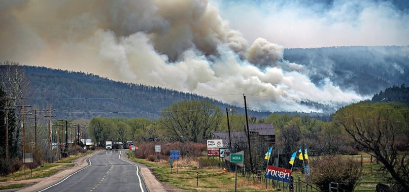 NO GOOD PLACE TO STOP IT: MORE PEOPLE FLEE NEW MEXICO WILDFIRE