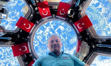 Space capsule with 1st Turkish astronaut on board closes hatch to undock from Intl Space Station, then bound for Earth