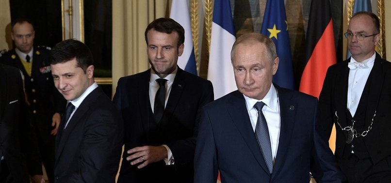 PUTIN MEETS UKRAINES ZELENSKIY FOR FIRST TIME AT PARIS PEACE SUMMIT