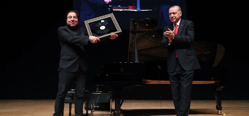 PRESIDENT ERDOĞAN PRESENTS FAMOUS TURKISH PIANIST FAZIL SAY WITH PLAQUE AT CONCERT