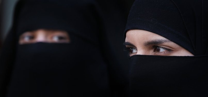 FACE-COVERING BAN IN QUEBEC GIVES WAY TO STRONG REACTIONS