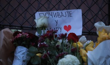 Thousands gather in Serbian capital to pay tribute to victims of school shooting