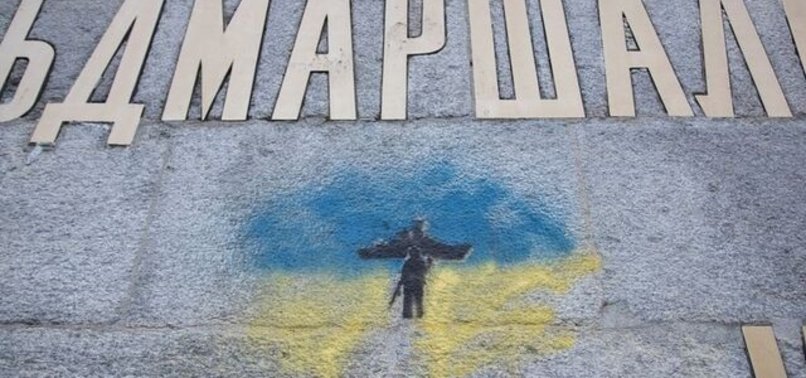 VANDALS DAUB UKRAINE COLOURS ON SWISS MONUMENT TO RUSSIAN SOLDIERS