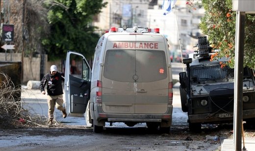 Israeli army shoots Palestinian child, runs over young man in West Bank raid