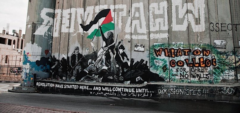 PALESTINIAN ARTIST TAQI SAPATEEN USE GRAFFITIS TO DESCRIBE ISRAELI OPPRESSION