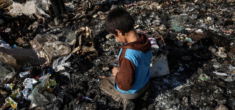 SYRIAN CHILDREN IN WAR-TORN IDLIB SCRAPE OUT LIVING IN GARBAGE DUMPS