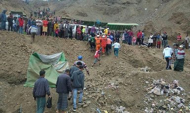 Three bodies found, but scores buried by landslide at Myanmar jade mine
