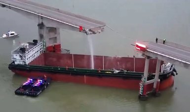 2 killed when cargo ship rams bridge in China, sending vehicles into water