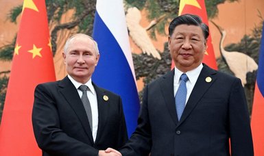 Putin, Xi hail Russia, China ties in letters to party-level dialogue