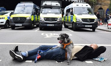 Climate protesters arrested as they block road to busy London Bridge