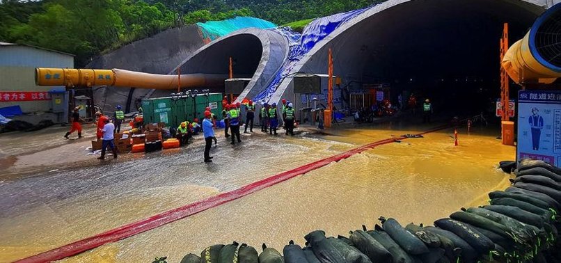 THREE CHINESE WORKERS FOUND DEAD IN FLOODED HIGHWAY TUNNEL