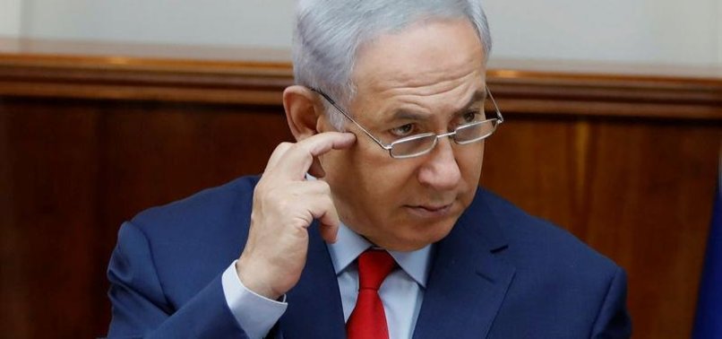 ISRAELS NETANYAHU LOOKS TO EXUDE CALM IN FACE OF CHARGES