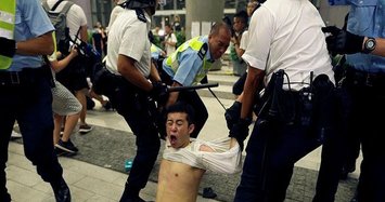 Hong Kong police force back protesters trying to storm parliament