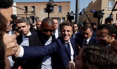 Macron, with eye on parliamentary vote, visits left-leaning Paris suburb