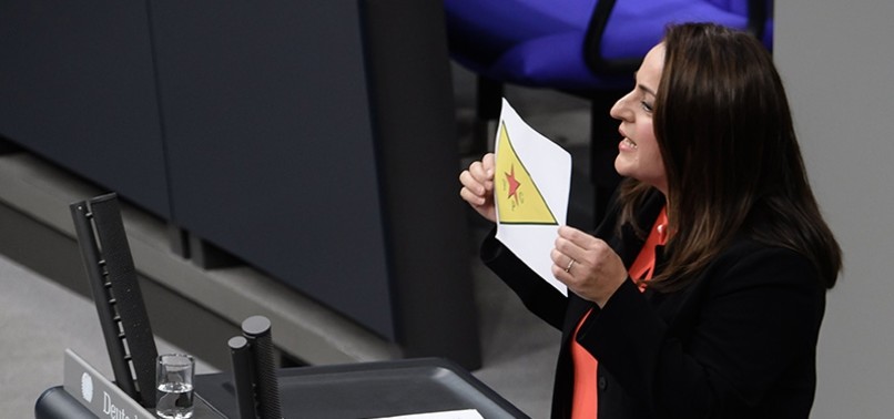 GERMAN LAWMAKER SPARKS CRITICISM AFTER DISPLAYING BANNED YPG FLAG IN PARLIAMENT