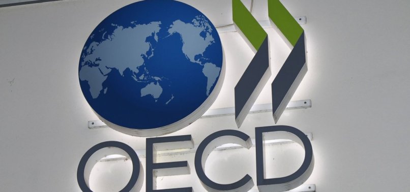 OECD CUTS WORLD GROWTH FORECAST, SAYS VACCINATION TOP PRIORITY