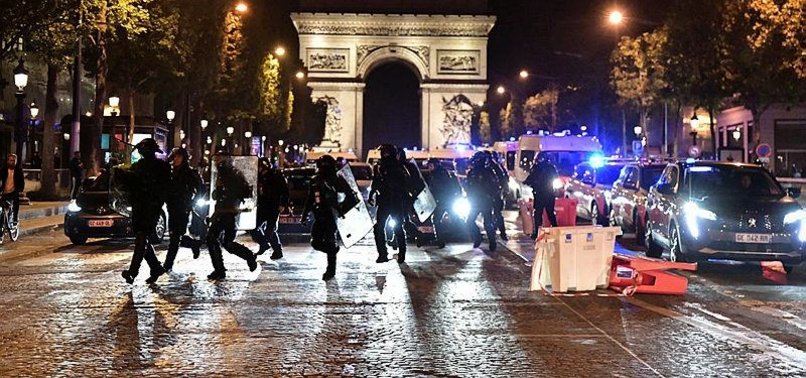 FRENCH POLICE EVACUATE PARIS CHAMPS-ELYSEES, INCLUDING TOURISTS, AMID ONGOING PROTESTS