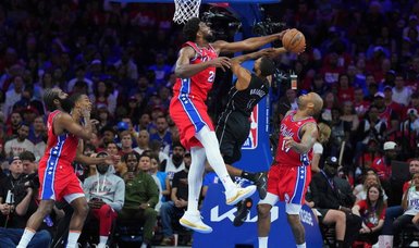 76ers drain 21 treys in opening win over Nets