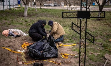 Mayor exhumed as Ukraine confronts grim cost of war
