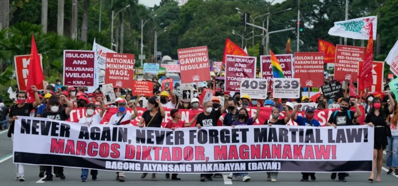 PHILIPPINE PROTESTERS VOW TO NEVER FORGET MARCOS ERA ABUSES