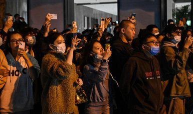 China COVID cases hit fresh record high after weekend of protests