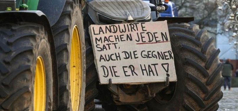BURNING TYRES, DUMPED MANURE: GERMAN FARMERS CONTINUE PROTESTS