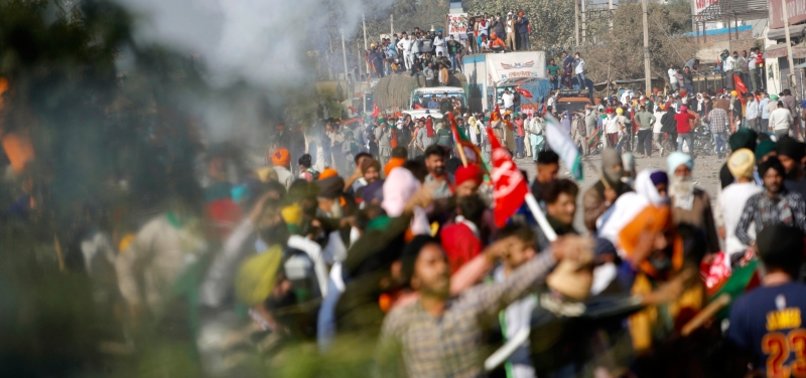 CLASHES ERUPT AS FARMERS BLOCKED FROM ENTERING DELHI TO PROTEST OVER NEW LAW