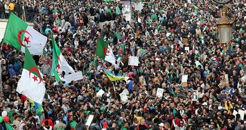 Algerians flood streets to mark the first anniversary of protest movement