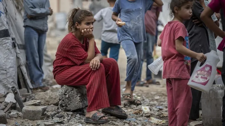 Displaced Gaza families struggle in tents near damaged Islamic University