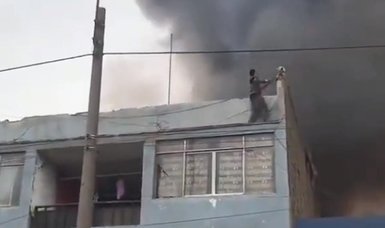 Heroic homeless man rescues 25 trapped dogs on burning recycling facility roof in Peru