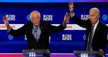 Sanders takes hits while gaining spotlight as front-runner