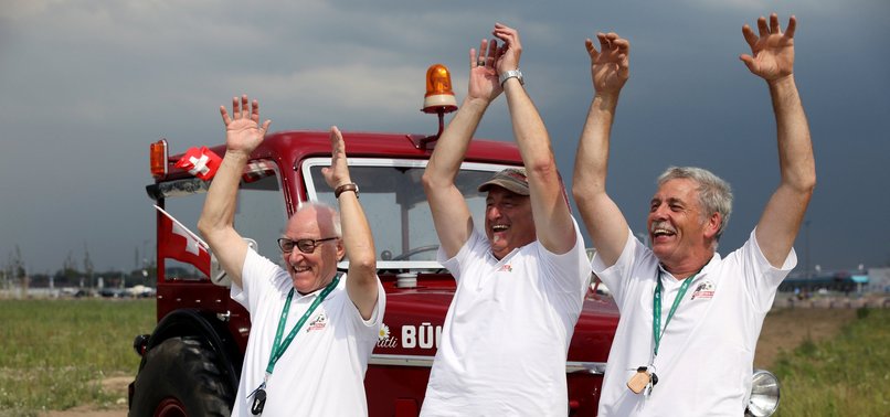 THREE SWITZERLAND FANS DRIVE 1,800 KM IN TRACTOR TO REACH WORLD CUP
