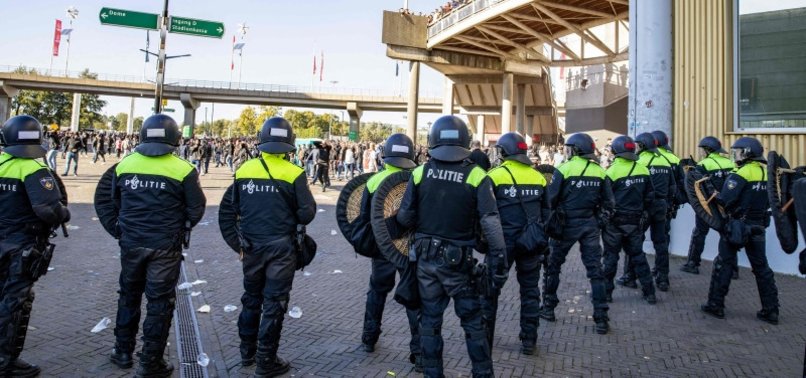 DUTCH POLICE USE TEAR GAS TO DISPERSE RIOTERS AFTER AJAX V FEYENOORD SUSPENDED