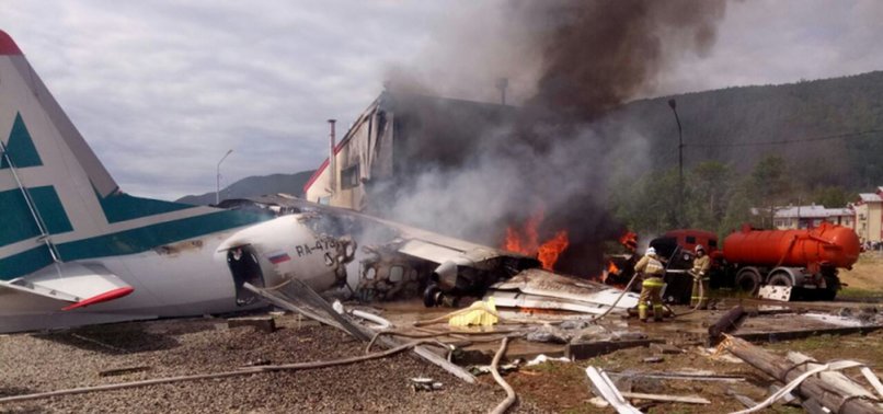 TWO KILLED AS PLANE HITS BUILDING IN SIBERIA