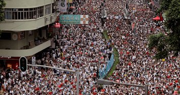 Hong Kong delays bill debate as protest crowds amass at HQ