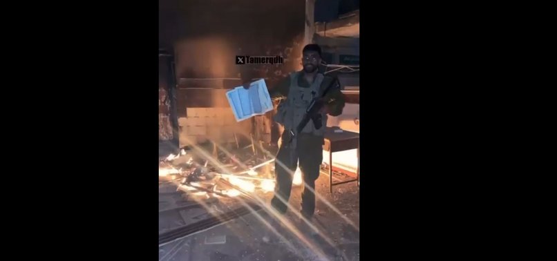 ISRAELI SOLDIER THROWS A COPY OF MUSLIM HOLY BOOK QURAN INTO FIRE IN GAZA