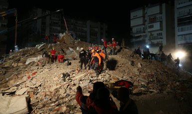 Turkish rescue team pulls 55-year-old survivor out of debris of collapsed building in quake-hit Izmir